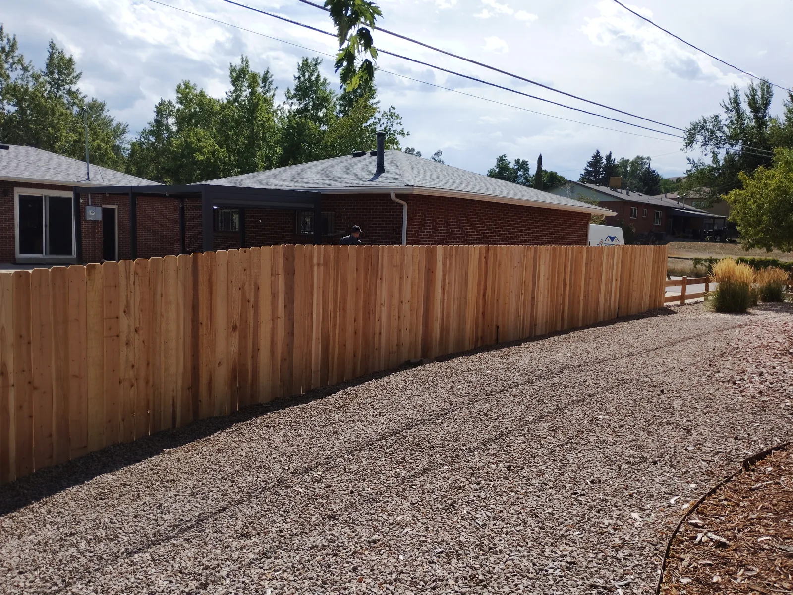 After: Completed cedar fence section