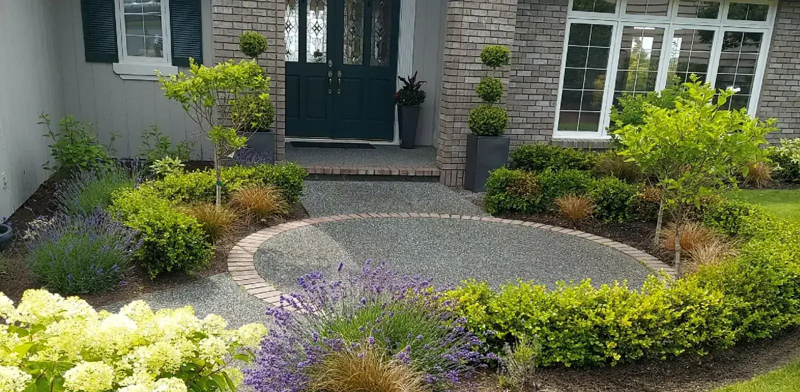 Transformed front circle with fresh landscaping