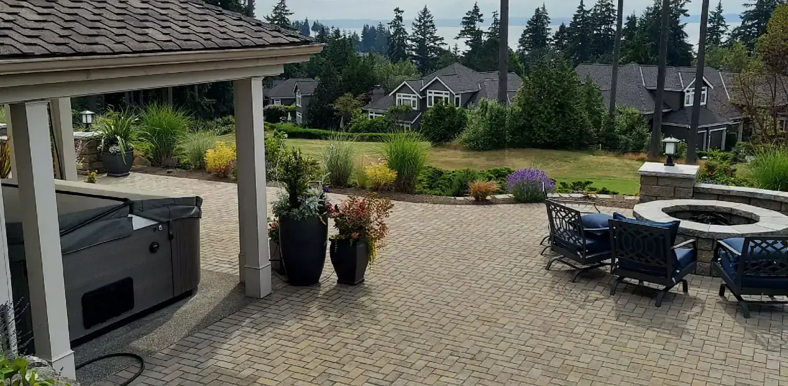 After: Custom stone firepit and patio seating area