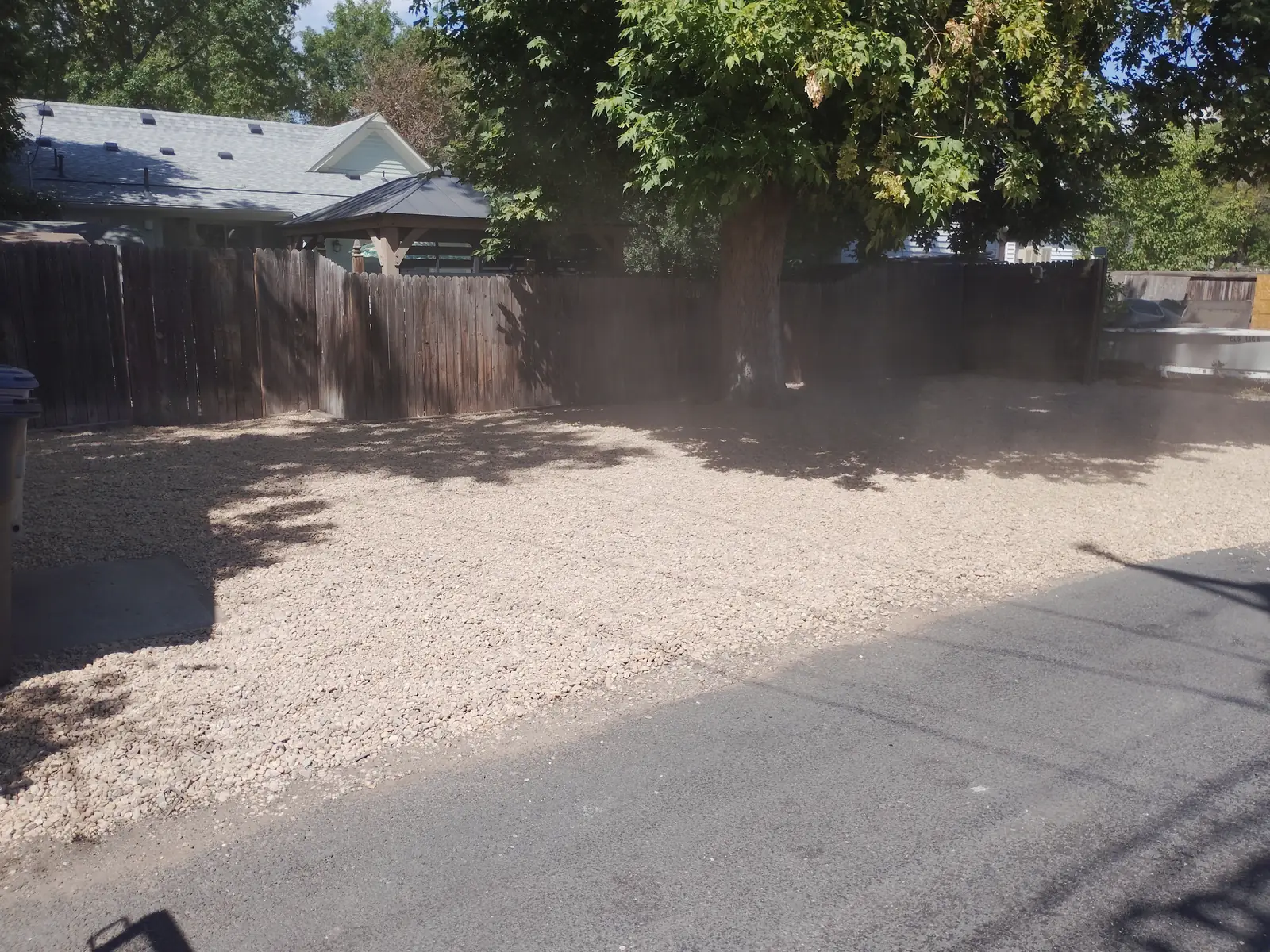 After: Completed ¼-inch river rock parking area in Longmont, CO