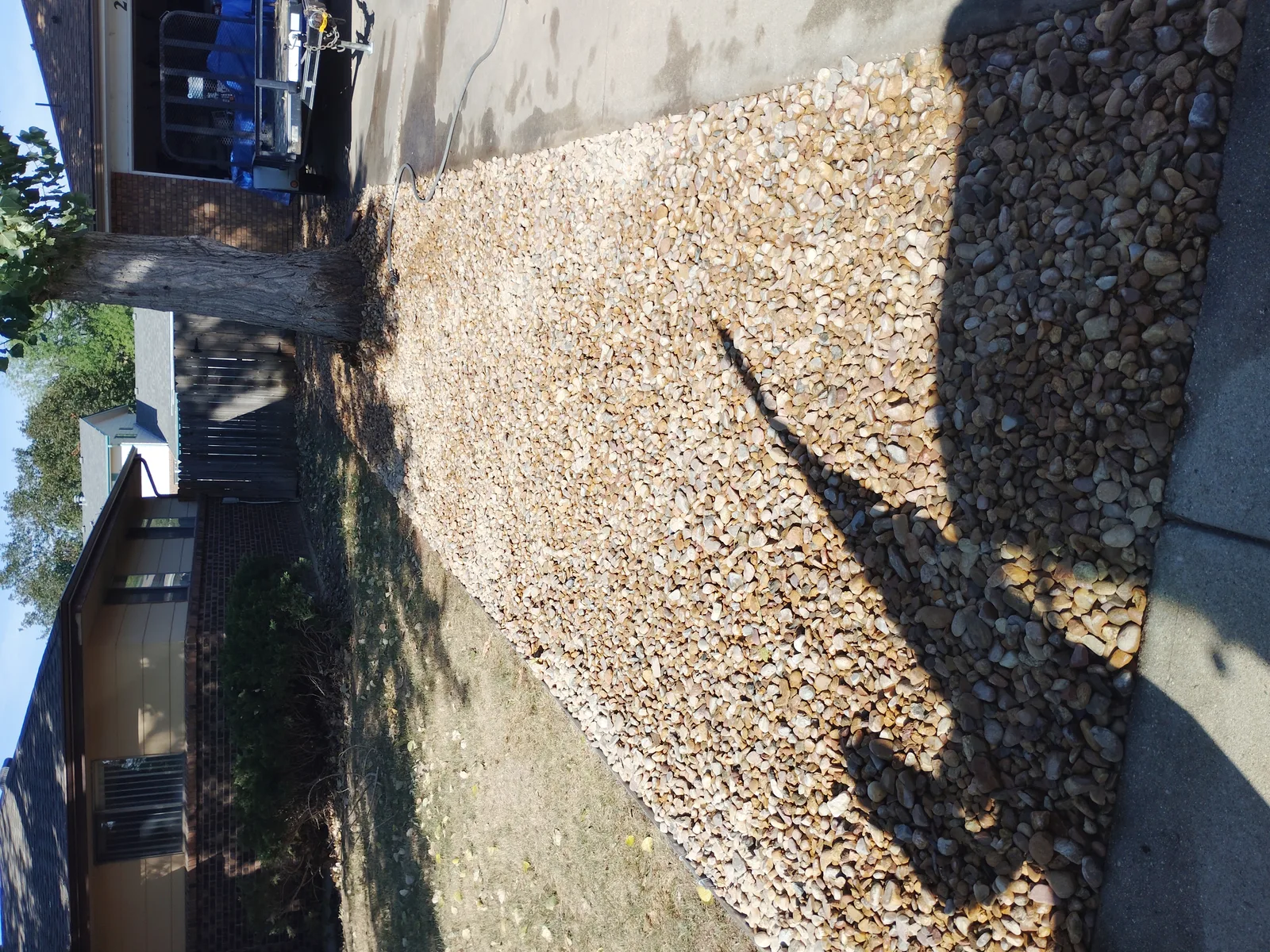 Finished river rock surface along the driveway