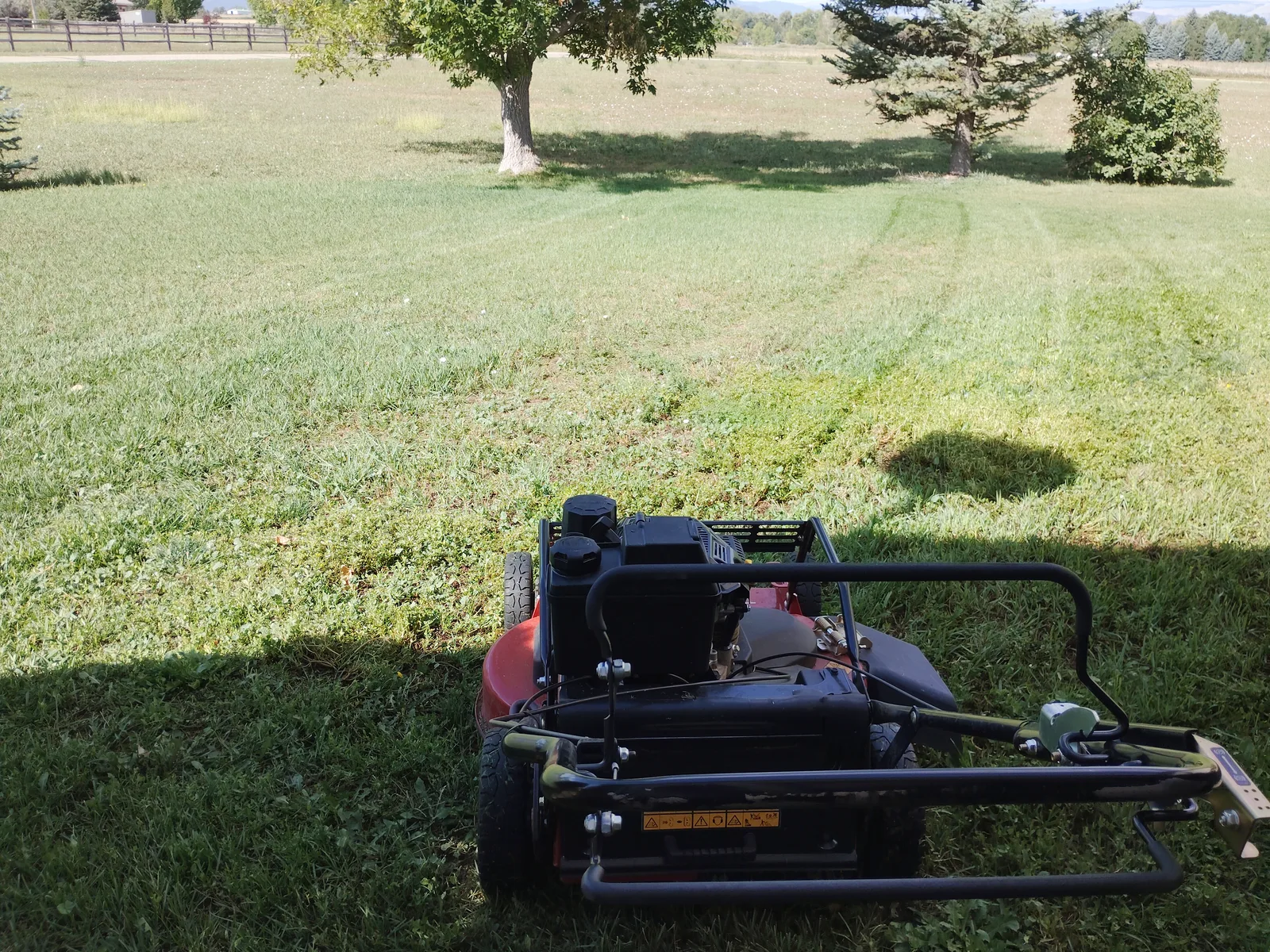 Mower at work on a Front Range property